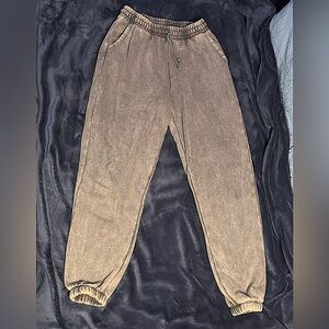 Washed-out gray sweatpants.